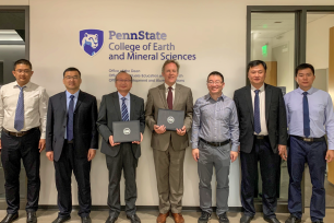 Delegation from the Shandong University of Science and Technology and Penn State members hold signed MOUs.