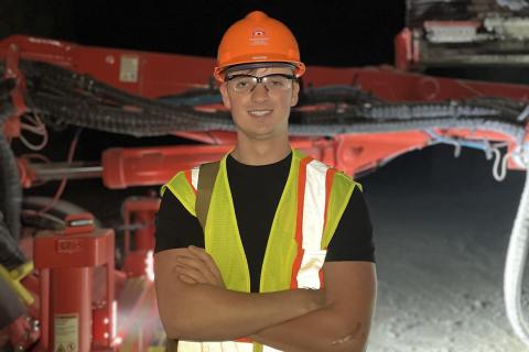 Joshua Hasenau in hard hat and reflective vest