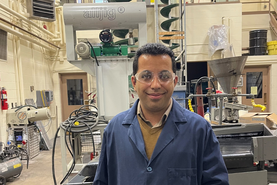 Mohammad Rezaee in lab coat smiling 